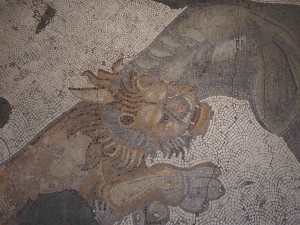 An elephant attacking a lion